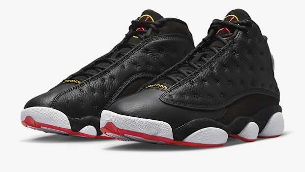 View of black, white, and red Air Jordan shoes.